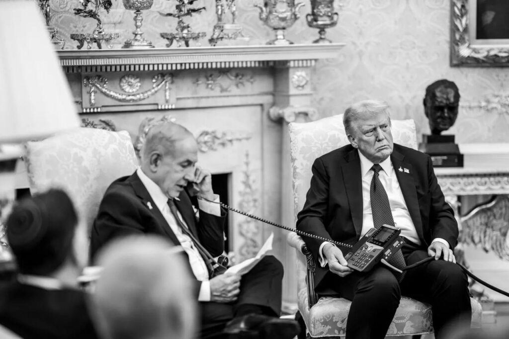 Benjamin Netanyahu reading the apology letter to Qatar's prime minister for the strike in Doha. (The White House)